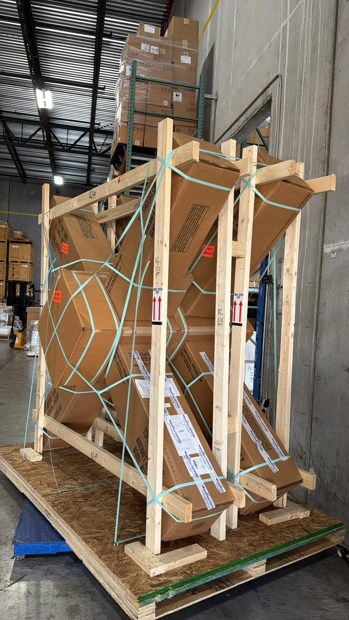 Side view of long components in a timber shipping frame.
