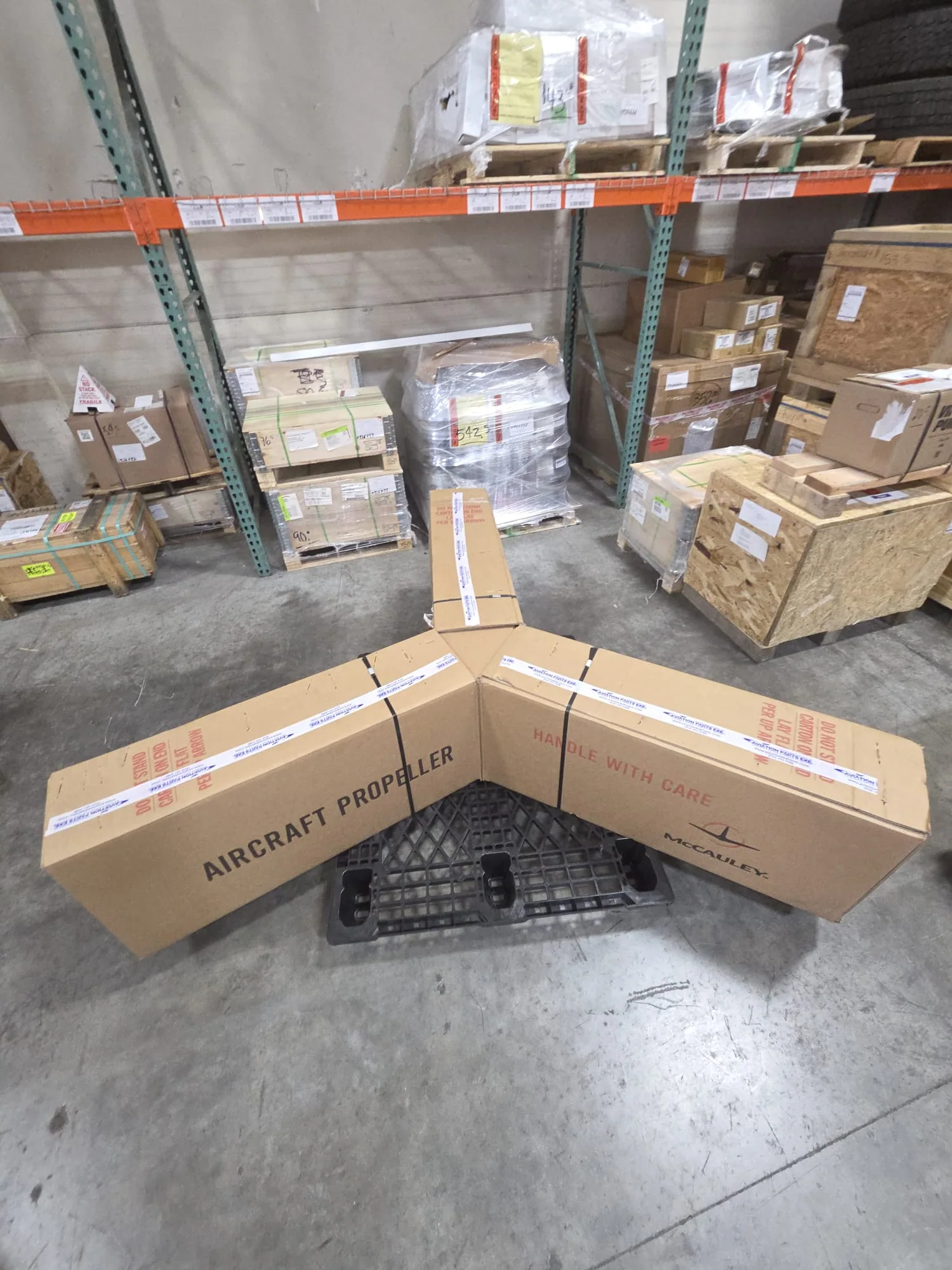 Second angle of packaged aircraft propellers on a pallet.
