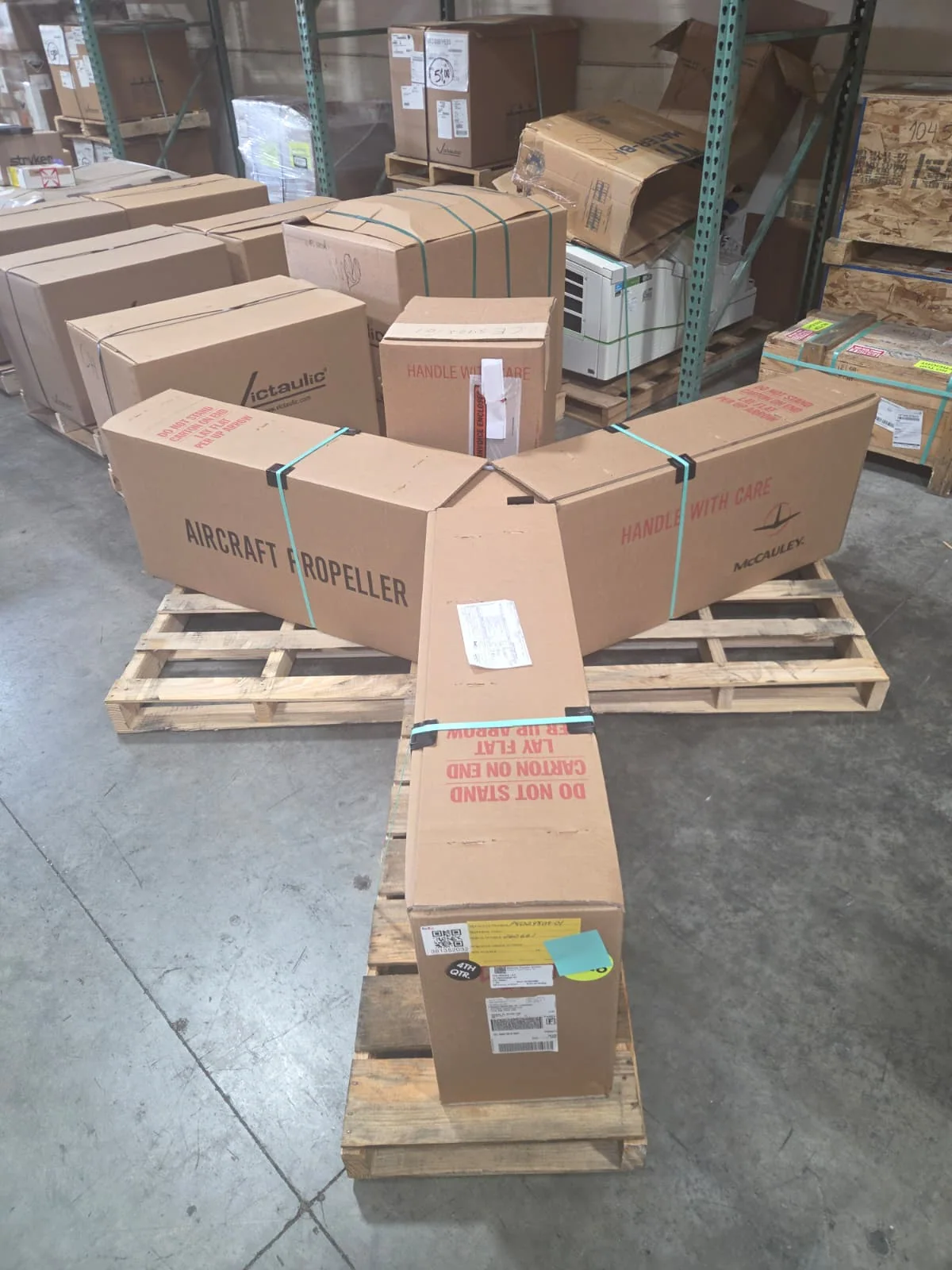 Aircraft propeller packages arranged on a pallet.