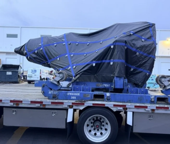 Rear view of a covered component secured for road movement.