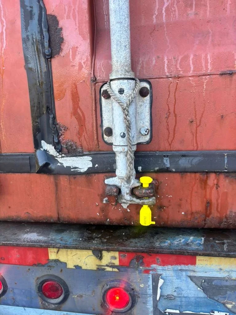 Closed rear doors of a container carrying a small aircraft.